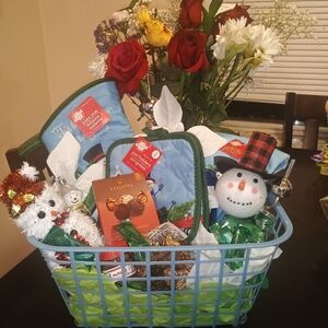 Festive Gift Basket with Snowman and Flowers